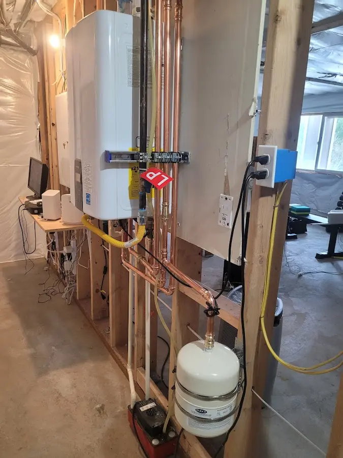 Licensed plumber repairing a kitchen sink in Middlebury